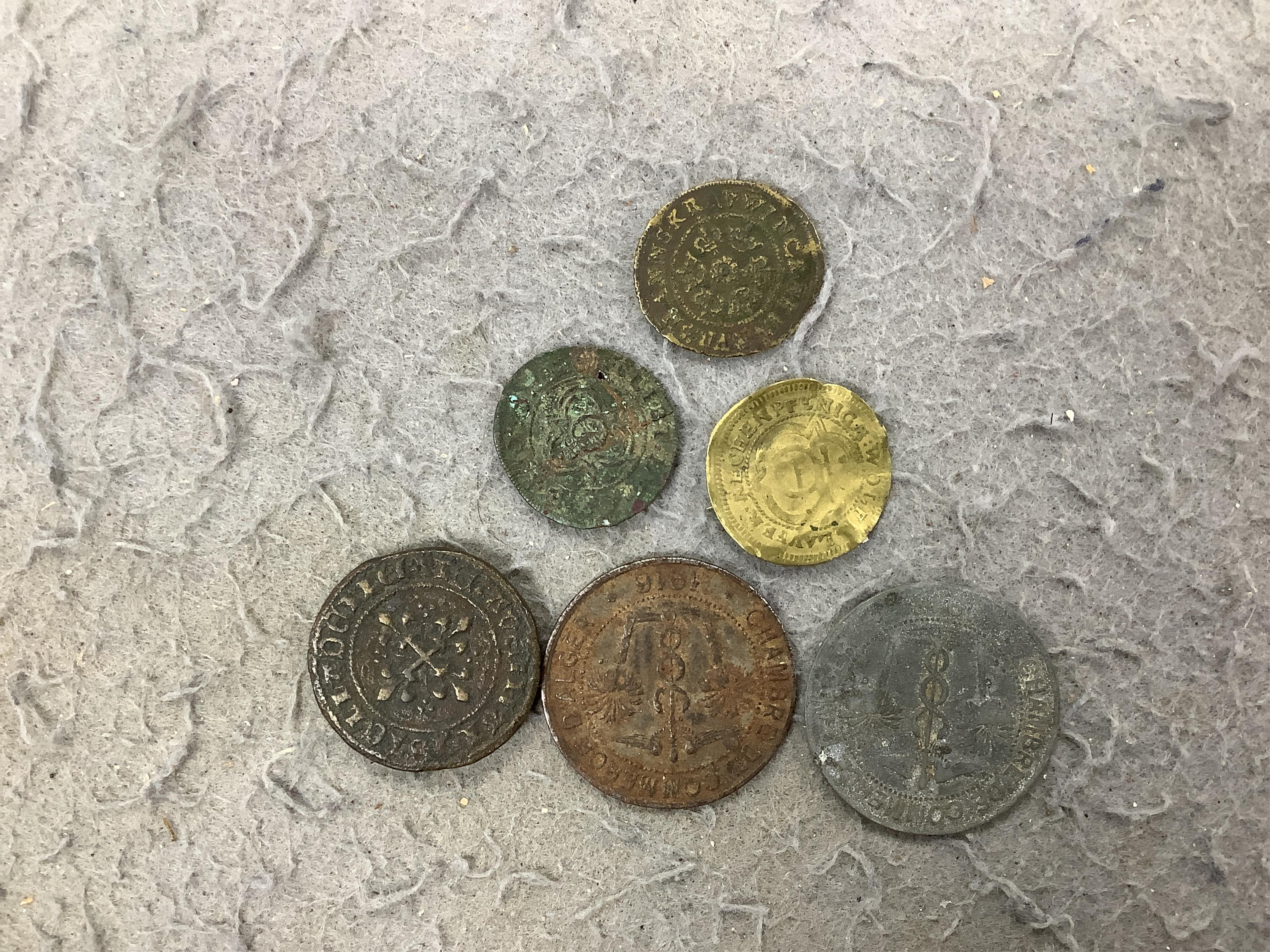 A large collection of halfpenny tokens and gaming tokens, 17th to early 20th century, in an album